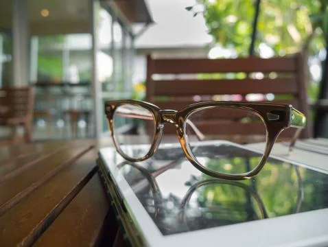 Vintage eyeglasses on the tablet computer Stock Photos
