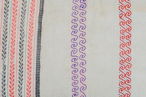 Vintage fabric, scrolling pattern in red and purple, green and orange Stockfoto's