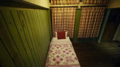 Vintage feeling tiny home with single bed and high roof Stock Footage 170515831