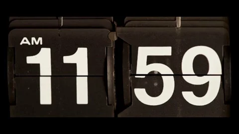 Vintage flip clock changes from morning to noon time Stock Footage 329667511