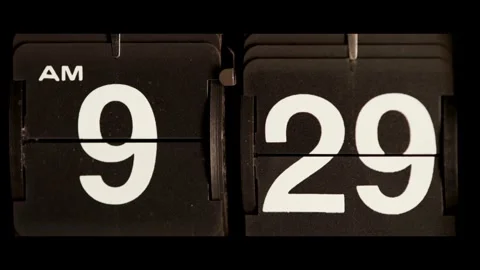 Vintage flip clock changes from nine twenty nine AM Stock Footage 329673676