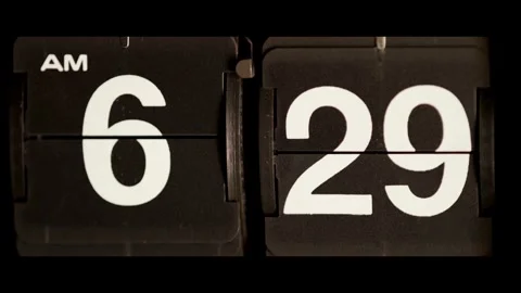 Vintage flip clock changes from six twenty nine am Stock Footage 329673943