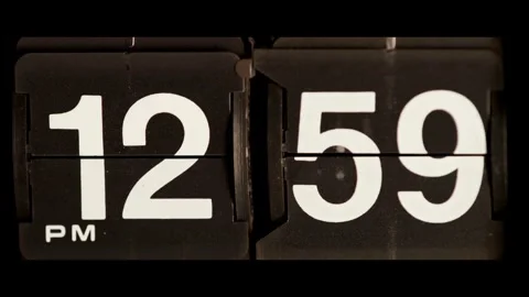 Vintage flip clock changes from twelve fifty nine pm Stock Footage 329667731