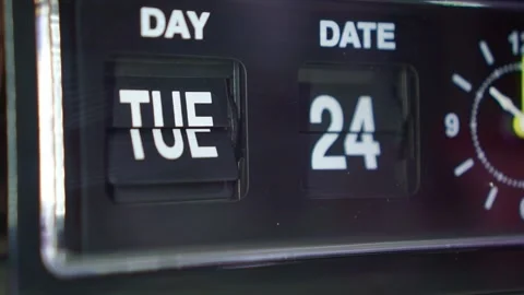 Vintage flip clock changing date display, retro timepiece in dark room, time Stock Footage 345869815