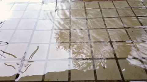 Vintage floor ceramic tiles pattern. washing with water view from above Stock Footage 319919996