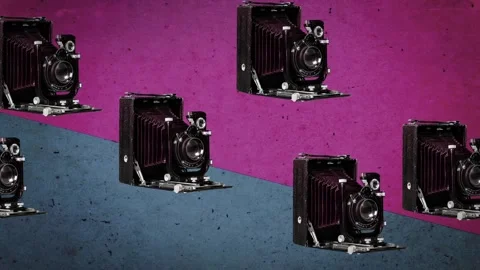 Vintage Folding Cameras Floating Over Color Shifting Walls Stock Footage 346783326