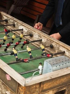 Vintage foosball table, worn wood frame Stock Photos