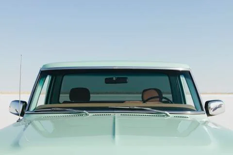 Vintage Ford F100 pickup truck, the windshield and hood. Stock Photos