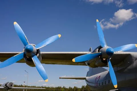 Vintage four-engine plane with shiny rivets. Old-fashioned twin-engine plane Stock Photos