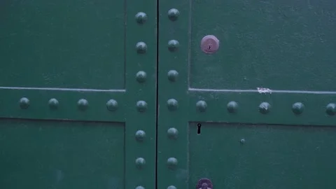 Vintage gate with decorative elements on building in street Stock Footage 139354482