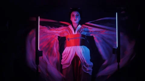 Vintage geisha portrait in dramatic studio lighting. Smiling Japanese girl. Video stock 337504697