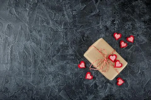 Vintage gift box - package, with blank gift tag on old wooden background. Stock Photos