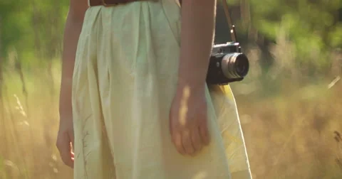 Vintage girl with camera in the fields Stock Footage 53124347