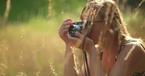 Vintage girl with camera in the fields Stock Footage 53125866