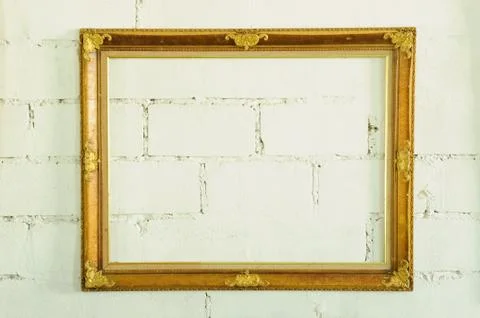 Vintage gold picture frame on white wall Stock Photos