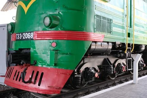 Vintage green train engine showcasing its vibrant design and power Stock Photos