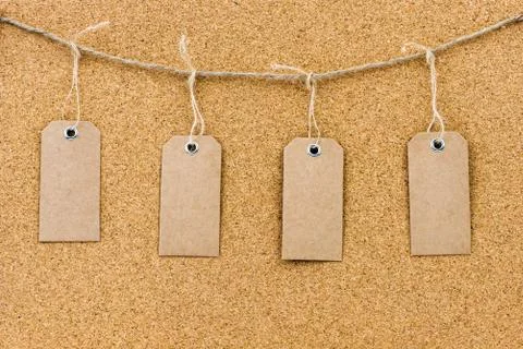 Vintage grunge empty tags hanging on rope string Stock Photos