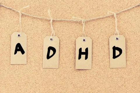 Vintage grunge tags with word ADHD Stock Photos
