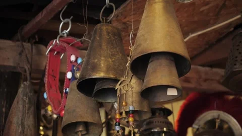 Vintage Hanging Bells Set in a Rustic Charming and Aesthetic Country Environment Stock Footage 282538403