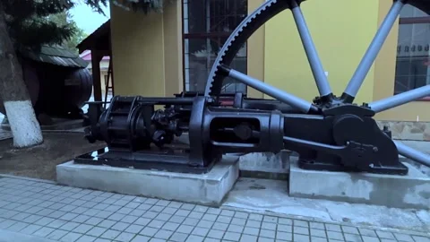 Vintage industrial steam engine with large flywhee Stock Footage 318757596