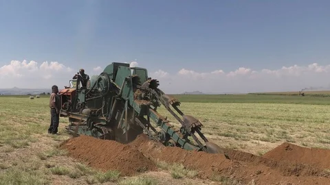 Vintage industrial trench digger full shot Stock Footage