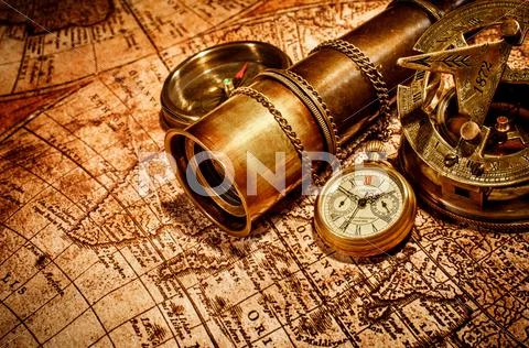 Vintage items on ancient map. Stock Photos