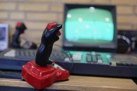 Vintage Joystick Controller in Front of Retro Monitor Foto stock