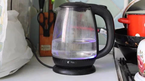 Vintage kettle boiling on stove in kitchen Stock Footage 311663889