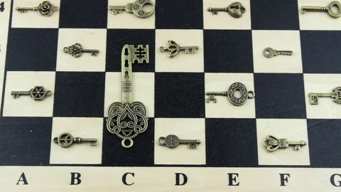 Vintage key on a chessboard Stock Footage 79640181
