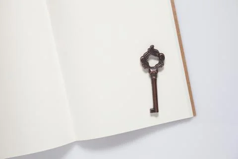 Vintage key with notebook Stock Photos