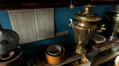 Vintage Kitchenware Display showcasing a Samovar and a selection of Antique Stock Photos