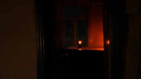 Vintage lamp lights on the table in the evening in abandoned house Stock Footage 296917550