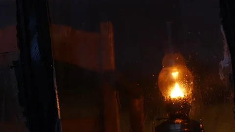 Vintage lamp lights through the window in the rain Stock-Footage 170349199