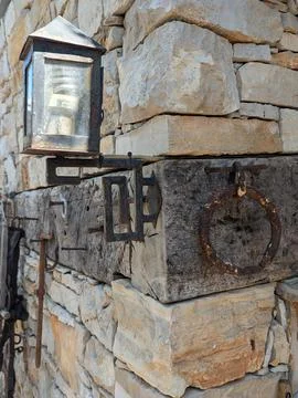 Vintage lantern attached to a stone wall corner in Croatia Stock Photos