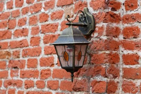 Vintage lantern on old brick wall Stock Photos