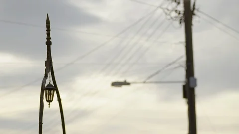 Vintage lantern with power lines in background Stock Footage 125054451