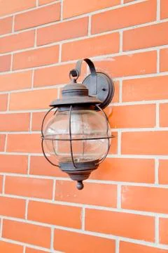 Vintage lantern on a wall. Stock Photos
