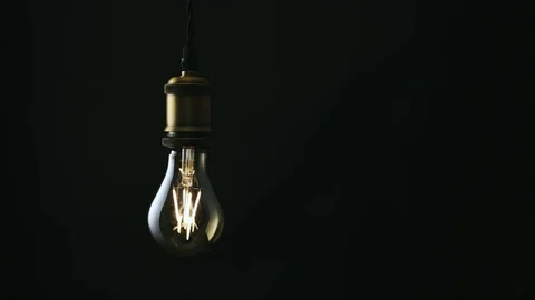 Vintage light bulb flickers - 4k Stock Footage 80064869