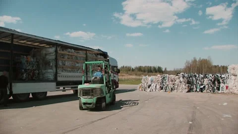 Vintage Loader work at recycling factory with paper and bottles 動画素材 91309352