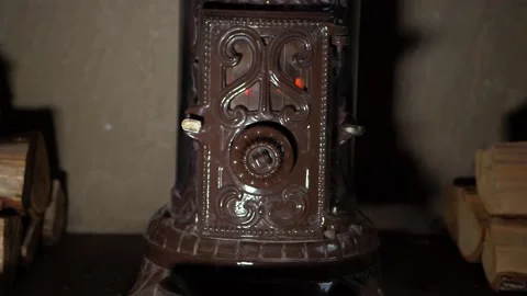 Vintage log burner surrounded by logs in hearth 스톡 동영상 149058237