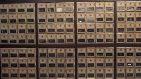 A Vintage Mailbox Collection Displayed Within a Postal Facility Setting, 스톡 동영상 295077314