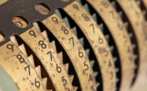 Vintage manual adding machine isolated, yellow Stock Photos
