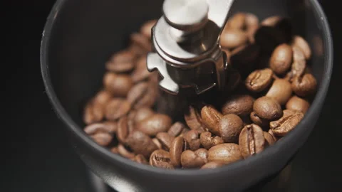 Vintage manual coffee grinder with falling coffee beans, close up Stock Footage 140201532