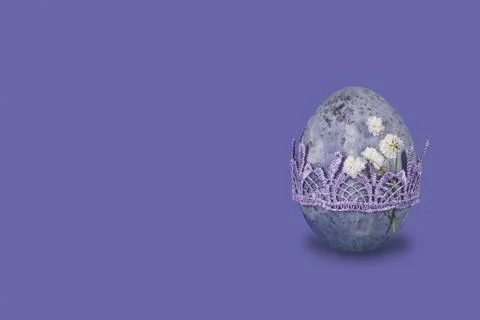 Vintage marble easter egg on very peri trendy background. Stock Photos