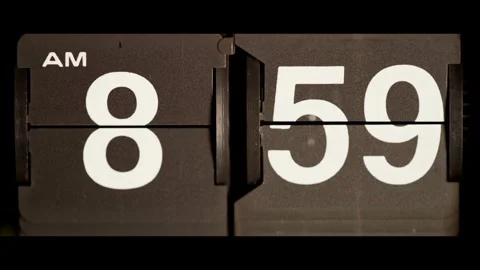 Vintage mechanical clock flips from eight fifty nine am Stock Footage 329673972