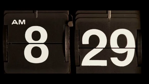 Vintage mechanical flip clock changes time to eight thirty Stock Footage 329673889