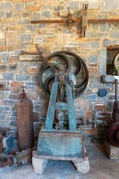 Vintage mechanical pump machine in old olive oil factory museum Stock Photos