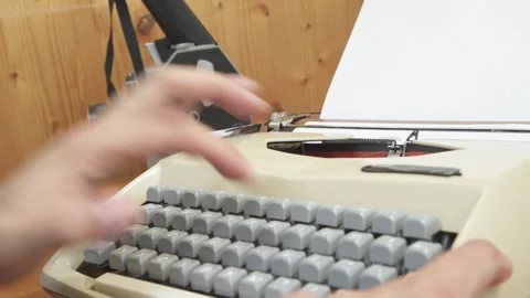 Vintage mechanical typewriter mid-action, featuring the word "SCREENPLAY" t.. Stock Footage 341438181