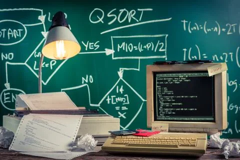Vintage methods of programming at school on old wooden table Stock-Fotos