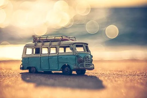 Vintage miniature van in vintage color tone, travel concept Stock Photos
